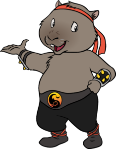 A cartoon wombat wearing a red headband, black pants, wristbands with yellow dots, and a black belt with a yellow buckle, standing upright and gesturing with one hand.